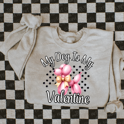  Taupe crewneck with pink balloon animal dog wearing a gold bow with polka dot background reading My dog is my valentine. Perfect for a valentines t-shirt. 