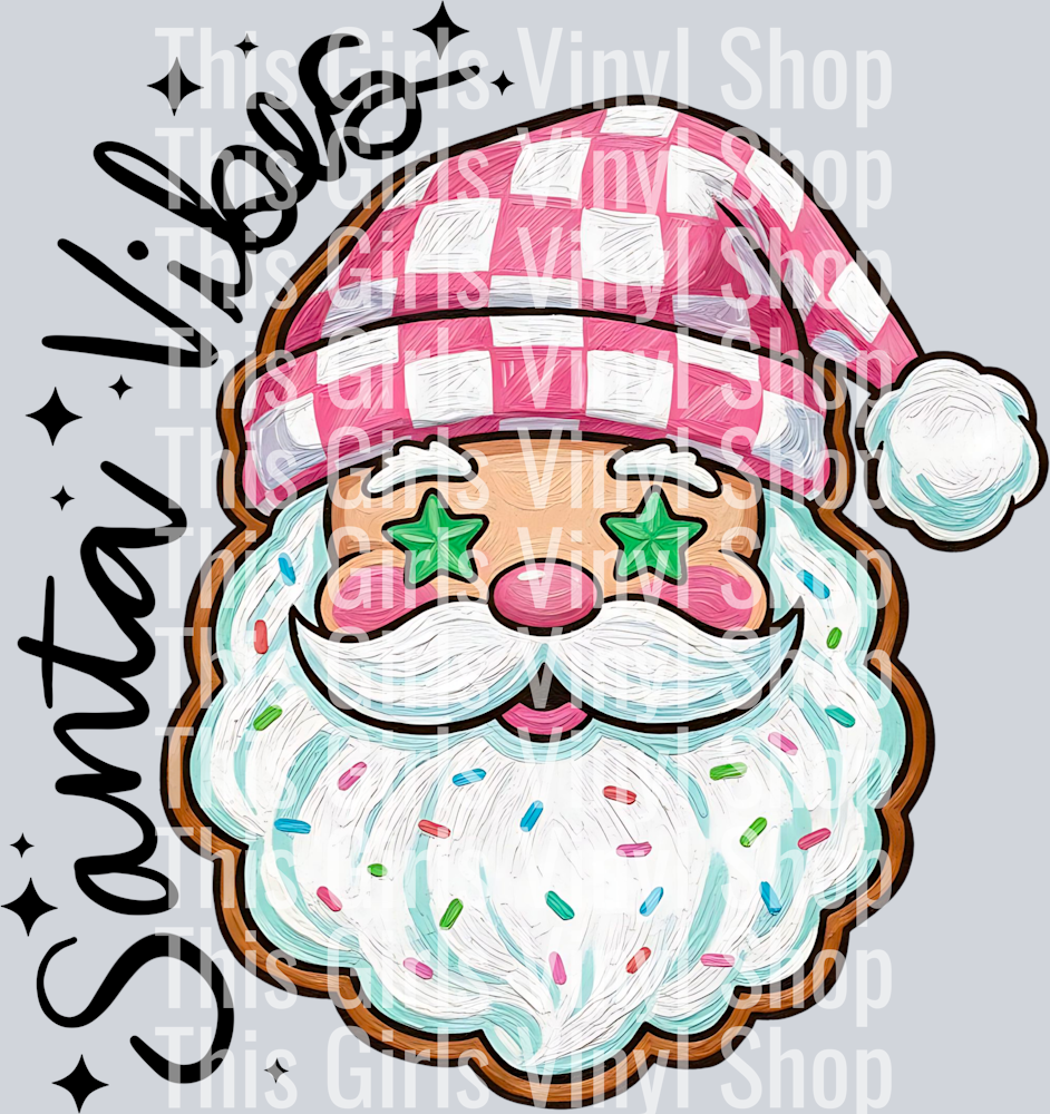 Image of Santa's head as a gingerbread cookie with him wearing a pink checker hat, green star eye sprinkles and little bits on sprinkles in his beard and wording on the side of him that says Santa Vibes,. Perfect for a Christmas t-shirt