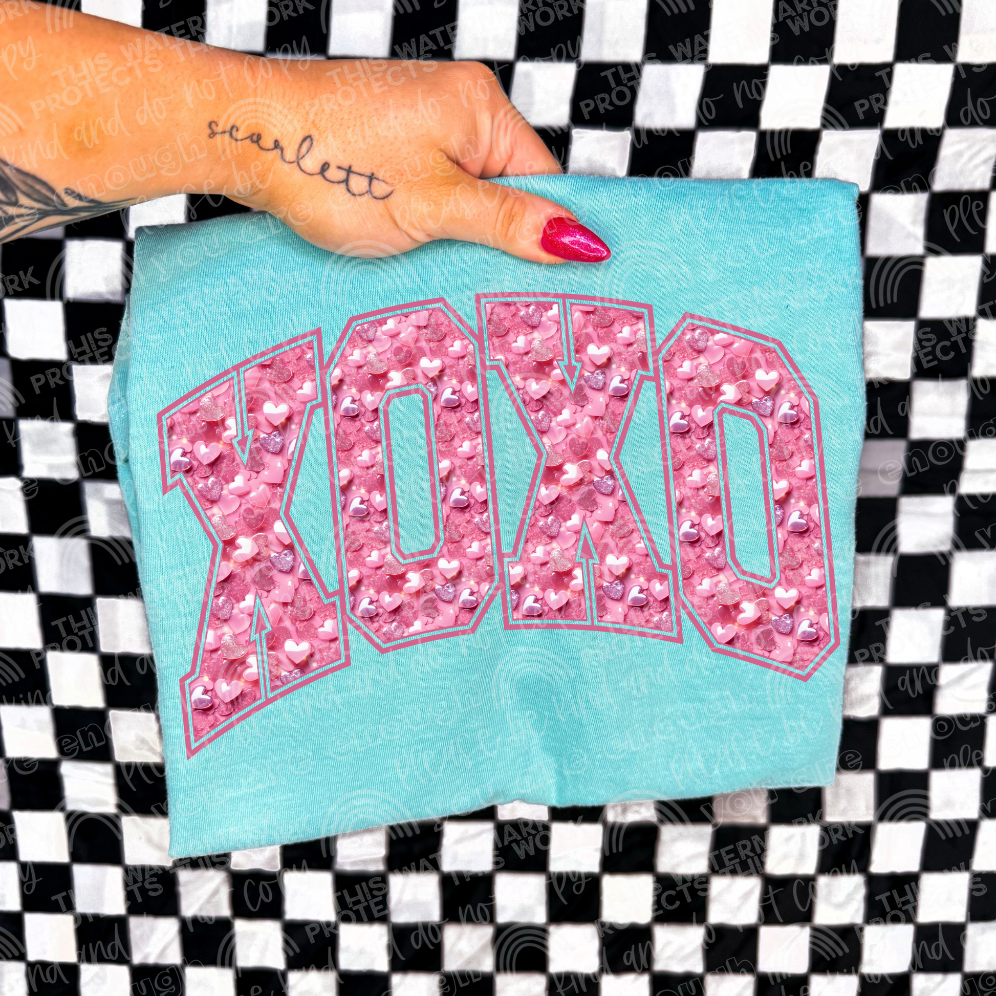 Light blue shirt that says xoxo in pink heart sequin. Perfect for  valentines t-shirt.